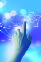 a hand pressing a button on a blue background photo