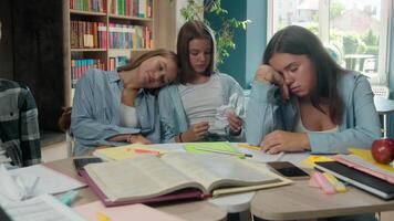 Four lazy napping stressed overload overworked tired students pupils classmates teenagers sleeping exhausted preparing to exams difficult education in school health problem chronic lack energy study video