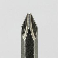 Closeup of a screw driver tip isolated on white photo