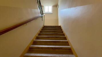 Exploring Stairway Perspective Bathed in Soft, Warm Lighting for a Captivating Atmosphere photo