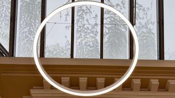 A Modern Circular Pendant Light Designed for an Artistic and Aesthetically Pleasing Setting photo
