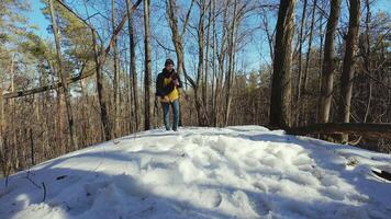 person standing on top of snow covered hill video
