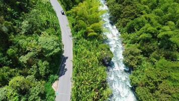Aerial View of Road Alongside River, Scenic Drive Through Landscape video