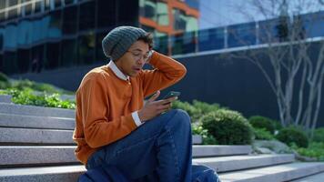 Shocked student reading bad news on phone video