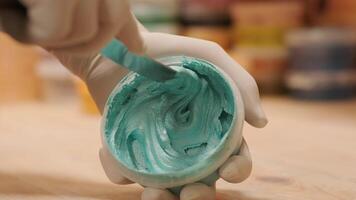 A worker mixes the material for puttying the walls 10 video