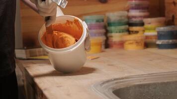 A worker mixes the material for puttying the walls 6 video