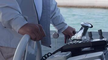 Close-up of the captain's hands at the helm. He controls the movement of the yacht. video