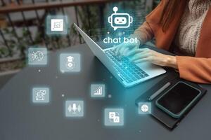 Person using a laptop with chatbot icons and digital graphics in a modern workspace environment photo