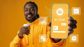 Smiling man showcasing AI chat application on smartphone while holding coffee in bright studio setting photo