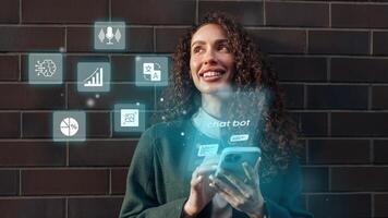 Young woman interacting with a smartphone while engaging with chatbot features against a dark brick background photo