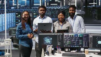 Portrait of smiling data center technicians analyzing infrastructure issues using node tree tools. Happy server hub specialists review AI visualization insights to optimize system health, camera A video