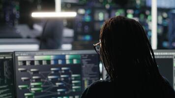 Data center computer scientist using node tree software to analyze datasets. Server farm IT worker using visual programming to improve infrastructure performance, camera B video