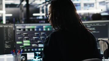 Vertical Angry server hub developer frustrated by slow data analytics AI generator. Annoyed data center worker punching desk, irked by glitching artificial intelligence program showing system metrics, camera B video