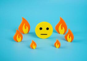 Indifferent face surrounded by fire. Indifference to surrounding events and lack of reflection. Public fatigue, media saturation, or disconnect between personal wellbeing and external turmoil. photo