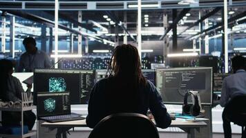 Irked data center IT expert smashing desk, upset by malfunctioning gear while using node tree software. Mad server hub engineer disgruntled by errors, using glitching AI visualization tech, camera A video