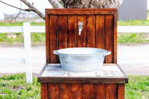 Rustic outdoor wash basin designed for gardens or farm settings photo