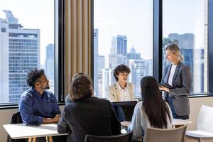 Caucasian woman sale manager is showing annual report to her colleagues in executive meeting for next year plan with market share increase for global business and investment usage photo
