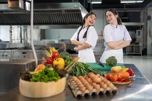 Culinary school student is posing inside the kitchen with fresh ingredient for cooking class school and education photo