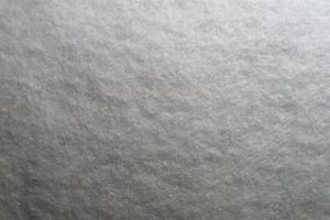a close up of a snow covered surface photo