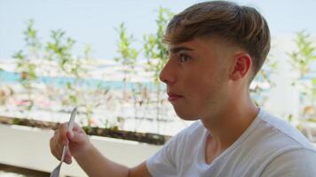 Young Man Slowly Eating And Savouring The Gourmet Dish For Lunch At The Resort video