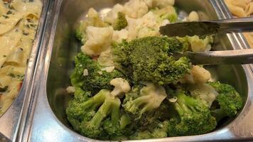 Freshly Steamed Broccoli, Carrots and Cauliflower Florets in Serving Bowl at Dinner Table Ready to Serve and Eat. Boiled Vegetables for Healthy Eating Lifestyle 4K. video