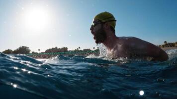 Swimmer Going Up And Under Water Doing Breaststroke Training In The Ocean video