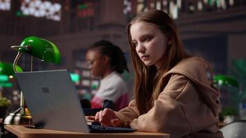 Diverse classmates sharing high five and feeling happy with their success, finishing school assignment in time and expecting a high grade. Girls doing amazing teamwork at the library. Camera A. video