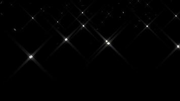 Abstract animation particles celebration party with falling silver paper confetti elements decoration sparkles, shimmering light on black background. video