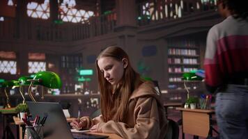Academic student working on diploma essay in a calm library environment, employing mixed educational database on campus. Dedication and strong focus on achieving intellectual goals. Camera B. video