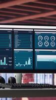 Vertical Desktop PC on the wooden desk showcases infographics and client reach data for professional use, analytics on display. Stylish, organized workspace in a bright luxurious loft home. video