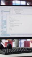 Vertical Home office with PC running terminal window for programming code. Designed for IT professionals, the space offers comfort for working on user interface, debugging and algorithm scripts. video