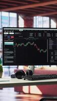 Vertical Modern home with PC monitor ready for online stock trading and forex analysis. Luxurious loft interior blending high end furniture and a computer with financial chart visualization. video