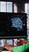 Vertical System administrator programming AI brain computerized model of neural network for machine learning, solving tasks on computer. Debugging software algorithm and checking for errors. Camera A. video