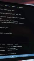 Vertical Young IT engineer typing code on computer and running script, programming language. African american technician in modern loft fixing errors within the software, implementing features. Camera A. video