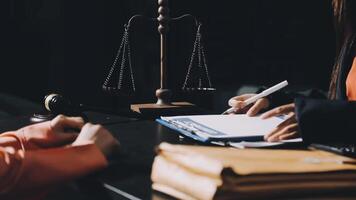 A lawyer writing on a notepad in front of a desk video