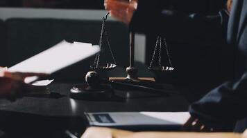 A lawyer holding a scale of justice in front of a judge video