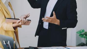 A man and woman are arguing in an office video