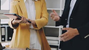 A man and woman in business attire talking to each other video