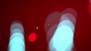 Abstract Light Display on Vivid Red Gradient Background with Bokeh Effect video