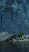 CGI rocky cliffs in the ocean at sunny day video