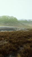 CGI Rocky desert landscape with sparse vegetation and mountains peaks video
