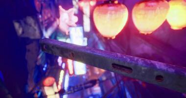 Realistic CGI Neon lights illuminate a bustling street in an urban setting at night video