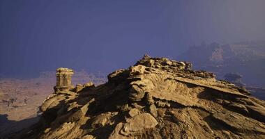 CGI Rock formations under a clear sky in a desert landscape during daylight video