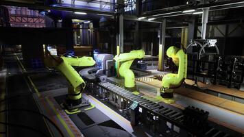 Realistic CGI Robotic arms operate on an assembly line in a modern manufacturing facility video
