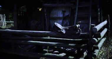 CGI of a rustic or vintage style motorcycle resting on a weathered wooden fence in what appears to be a rural or overgrown setting video