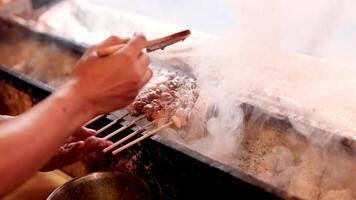 Sizzling meat cooked on a heated stone surface video