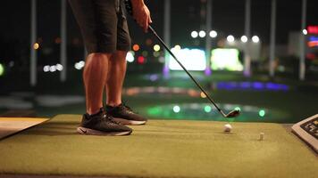 Golfer preparing and swinging at driving range video