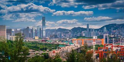 Hong Kong city on dramatic sky at sunset view from mountain. photo