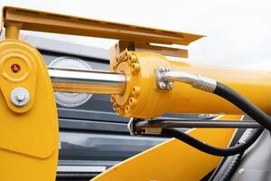 Closeup of hydraulic cylinder. Selective focus. photo