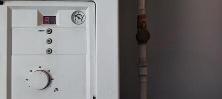 Gas Boiler a Control Panel with Error Code E1. Heating System Maintenance, Utility Technology, Home Appliance photo